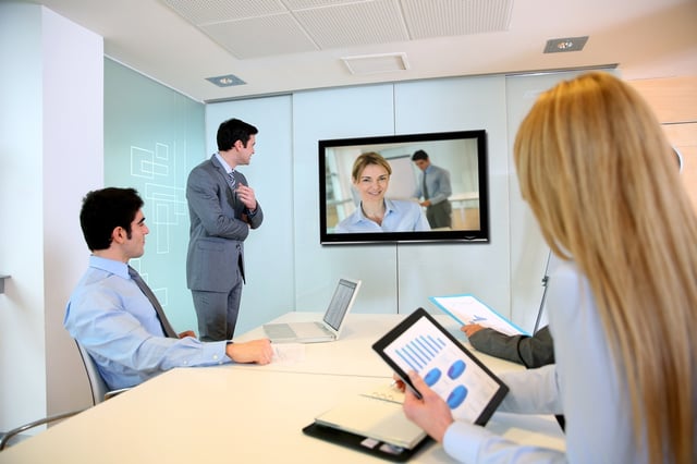 Business people attending videoconference meeting.jpeg